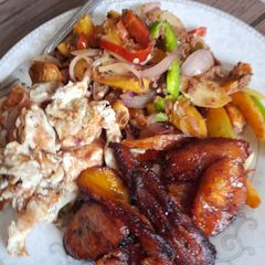 A picture of Potato beef stir fry, fried plantain with scrambled eggs.