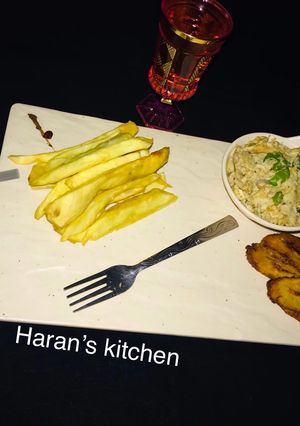 A picture of Fried sweet potatoes with plantain and scrambled eggs.