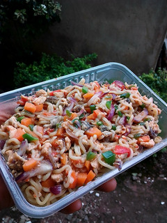 A picture of Assorted chicken and veggies noodles.