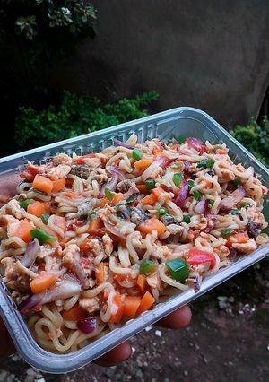 A picture of Assorted chicken and veggies noodles.