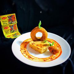 A picture of Masala magic savoury falafel doughnut with masala magic garlic hummus.