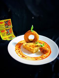 A picture of Masala magic savoury falafel doughnut with masala magic garlic hummus.