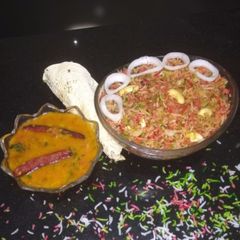 A picture of Biryani with dal dry.