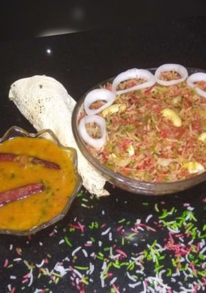 A picture of Biryani with dal dry.