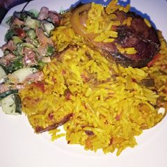 Palm oil Jealof rice With salad A picture of Palm oil Jealof rice With salad.