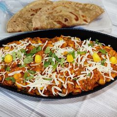 A picture of Cheesy Masala Corn Sabzi.