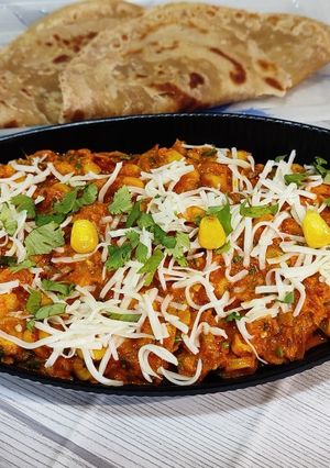 A picture of Cheesy Masala Corn Sabzi.