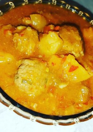 A picture of Meat ball and potato soup.
