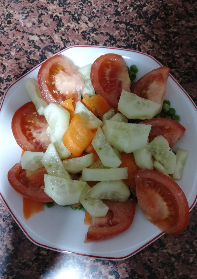 Una foto de Ensalada de zanahoria y guisantes