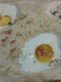 Huevos asados en cama de puré de papas