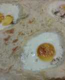 Huevos asados en cama de puré de papas