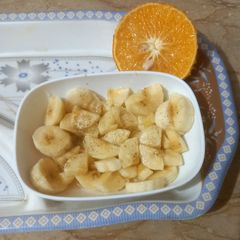 A picture of Banana with orange juice 🍌🍌🍊🍊.