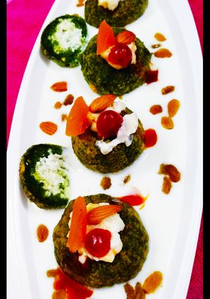 A picture of Spinach paneer balls in Yoghurt.