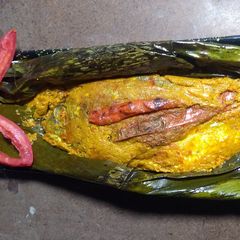 A picture of Seafood Special - IKAN PEPES (Grilled Fish in Banana Leaf).