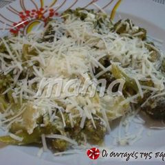 A picture of Sautéed broccoli with feta cheese.
