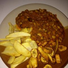 A picture of Beans, fried plantain and potatoes.