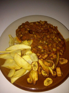 A picture of Beans, fried plantain and potatoes.