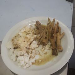 A picture of Chicken legs with pap.