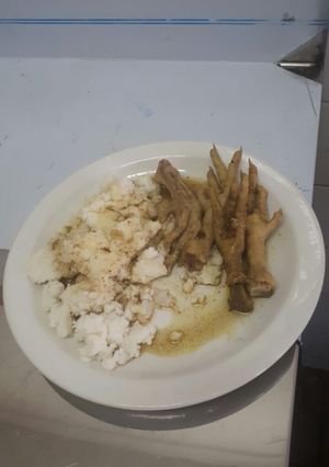 A picture of Chicken legs with pap.