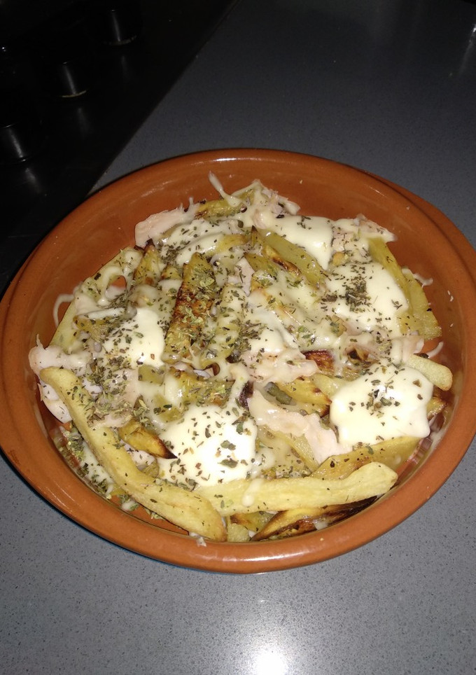 Una foto de Patatas al horno con queso y pavo