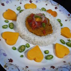 A picture of Daal chawal with mango salsaa.