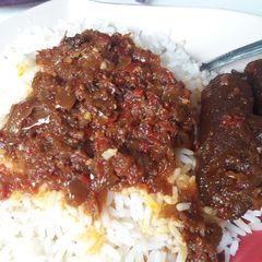 A picture of Rice with onion stew.