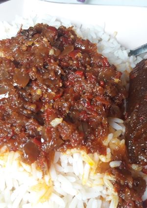 A picture of Rice with onion stew.