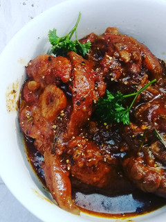 A picture of Pork shank in red wine and balsamic sauce.