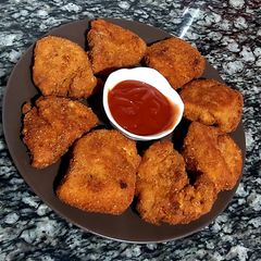 Crispy fried chicken tenders A picture of Crispy fried chicken tenders.