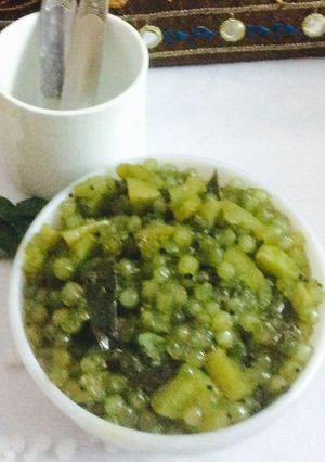 A picture of Sago pearls in green chutney.