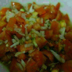 A picture of Salsa with thinly diced cucumbers.