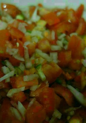 A picture of Salsa with thinly diced cucumbers.