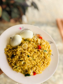 A picture of Simple noodles with boiled eggs.