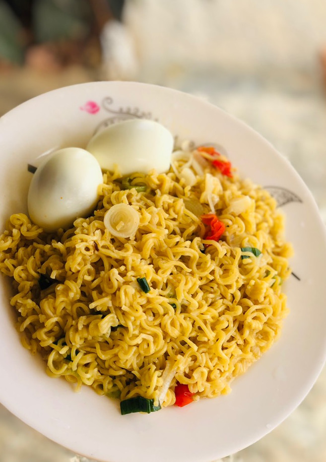 A picture of Simple noodles with boiled eggs.