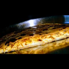 A picture of Cheese schezwan aloo paratha.