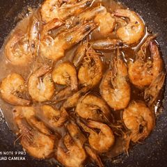 A picture of Buttered garlic Prawn w/sprite and hoisin sauce.