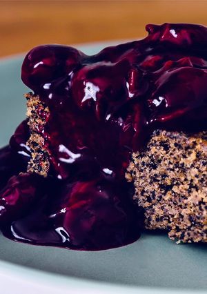 A picture of Vegan Poppyseed Pie with Cherry Sauce.