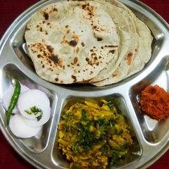 A picture of Baingan ka bharta and bhakri.