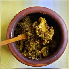 A picture of Aam Kasundi (Green Raw Mango with Mustard seeds).