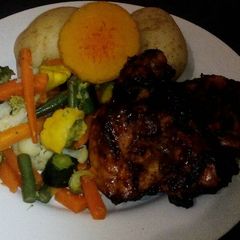 A picture of Vegetables and grilled chicken.