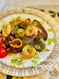 Ostrich stew with shrimp and sage