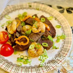 A picture of Ostrich stew with shrimp and sage.