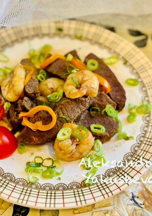 A picture of Ostrich stew with shrimp and sage.