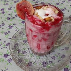 A picture of Strawberry crushed milk shake with vanilla ice cream.