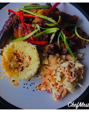 A picture of Orange-Spring Onions-Chilli Rice with Sticky Spicy Pork Ribs And Homemade Coleslaw.