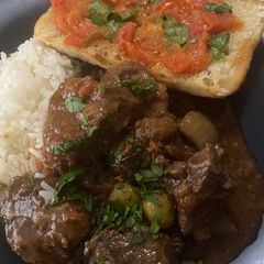 Spanish Slow cooked beef cheeks with tomato bread “Carrillada de Ternera” A picture of Spanish Slow cooked beef cheeks with tomato bread “Carrillada de Ternera”.