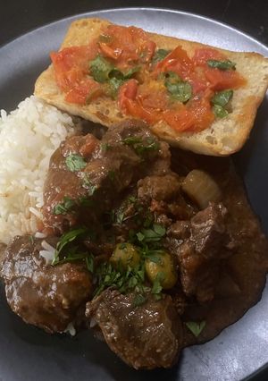 A picture of Spanish Slow cooked beef cheeks with tomato bread “Carrillada de Ternera”.