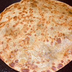 A picture of Alu and fresh meethi ke parathe.