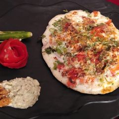 Onion uttapam A picture of Onion uttapam.