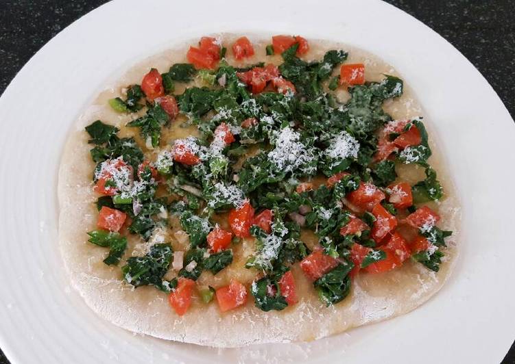 Spinach pizza baked on pan